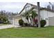 Charming single Gathering home with mature palm trees and manicured lawn at 30829 Iverson Dr, Wesley Chapel, FL 33543
