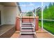 Outdoor hot tub is located on a screened in patio with steps to access, located in the backyard at 30829 Iverson Dr, Wesley Chapel, FL 33543