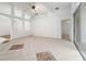 Spacious living room offers neutral walls, tile floors, and vaulted ceilings at 30829 Iverson Dr, Wesley Chapel, FL 33543