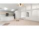 Open living room featuring neutral color ceramic tile flooring and ample lighting at 30829 Iverson Dr, Wesley Chapel, FL 33543