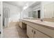 Large bathroom features double vanity, shower and soaking tub at 30829 Iverson Dr, Wesley Chapel, FL 33543