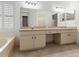 Bathroom features double vanity, walk in shower, soaking tub and large mirror at 30829 Iverson Dr, Wesley Chapel, FL 33543