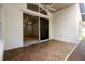 An outdoor patio features a tile floor and sliding glass doors into the main living area at 30829 Iverson Dr, Wesley Chapel, FL 33543