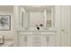 Elegant bathroom with double sinks, a marble countertop, and modern fixtures at 4511 S Manhattan Ave # 25, Tampa, FL 33611