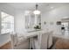 Elegant dining area with bright white walls, stylish seating, and ample natural light at 505 Stratfield Dr, Lutz, FL 33549