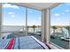 Bright bedroom with floor to ceiling windows and fantastic views of the harbor and palm trees at 5120 Marina Way # Slip Ew 17, Tampa, FL 33611
