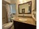 Bathroom features granite counters, stainless steel faucet fixtures, and tub/shower combo at 601 N Hercules Ave # 403, Clearwater, FL 33765