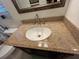 Bathroom features granite counters and a sink with stainless steel faucet fixtures at 601 N Hercules Ave # 403, Clearwater, FL 33765