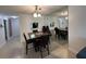 Dining space with large mirror, tiled flooring, and bar seating view into kitchen at 601 N Hercules Ave # 403, Clearwater, FL 33765