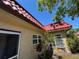 Charming home featuring a durable red tile roof, neutral stucco walls, and well-maintained landscaping at 601 N Hercules Ave # 403, Clearwater, FL 33765