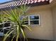 Home exterior with stucco and tile roof at 601 N Hercules Ave # 403, Clearwater, FL 33765
