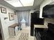 Galley kitchen features black appliances, tile flooring, and stylish granite countertops for a modern, functional space at 601 N Hercules Ave # 403, Clearwater, FL 33765