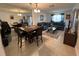 Open-concept living area featuring tile flooring, dining space, and comfortable seating at 601 N Hercules Ave # 403, Clearwater, FL 33765