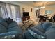 Living room featuring a comfortable sofa, modern coffee table, and tile floors at 601 N Hercules Ave # 403, Clearwater, FL 33765
