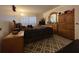 Bedroom features a large bed, dresser, armoire, and a patterned rug at 601 N Hercules Ave # 403, Clearwater, FL 33765