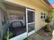 Enclosed home patio with cushioned seating at 601 N Hercules Ave # 403, Clearwater, FL 33765
