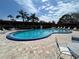 Sparkling community pool with lounge chairs, perfect for relaxation and enjoying sunny days at 601 N Hercules Ave # 403, Clearwater, FL 33765