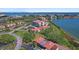 Stunning aerial view of residential condos boasting pristine lawns and neighborhood street at 6158 Palma Del Mar S Blvd # 406, St Petersburg, FL 33715