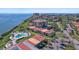 Aerial view of a waterfront community with swimming pool, beautiful landscaping and a view of the bay at 6158 Palma Del Mar S Blvd # 406, St Petersburg, FL 33715
