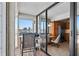 Open lanai with seating, dining table and a view of the bay at 6158 Palma Del Mar S Blvd # 406, St Petersburg, FL 33715