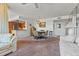 Spacious living area connecting to dining and kitchen, featuring neutral tones at 6158 Palma Del Mar S Blvd # 406, St Petersburg, FL 33715