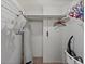 A walk-in closet with white walls and shelving, as well as carpeted floors and a number of storage options at 6158 Palma Del Mar S Blvd # 406, St Petersburg, FL 33715