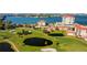 Beautiful aerial view of a well manicured golf course, luxury residences, and gorgeous waterfront views at 6265 Sun Blvd # 806, St Petersburg, FL 33715