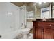 Well-maintained bathroom with white tiled walls and a classic wood vanity at 6265 Sun Blvd # 806, St Petersburg, FL 33715