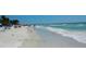 Breathtaking beach view with clear turquoise water, white sand, and sunny skies at 6265 Sun Blvd # 806, St Petersburg, FL 33715