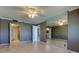 Bedroom featuring an ensuite bathroom, ceiling fan, and large mirrored wall at 6265 Sun Blvd # 806, St Petersburg, FL 33715