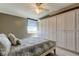 Cozy bedroom with built-in storage cabinets and serene views from the bright window at 6265 Sun Blvd # 806, St Petersburg, FL 33715