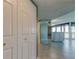 Bright entryway featuring tile flooring, mirrored wall, and partial view of the open concept kitchen and living spaces at 6265 Sun Blvd # 806, St Petersburg, FL 33715