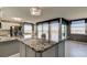 Gourmet kitchen featuring granite countertops, a center island, stainless steel appliances, and scenic views at 6265 Sun Blvd # 806, St Petersburg, FL 33715
