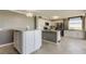 Well-lit kitchen with granite countertops, stainless steel appliances, and tiled floors at 6265 Sun Blvd # 806, St Petersburg, FL 33715