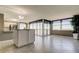 Bright living room with tile floors, large windows with water views, and stylish furnishings at 6265 Sun Blvd # 806, St Petersburg, FL 33715