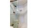 Walk-in shower with white subway tile and glass door at 6265 Sun Blvd # 806, St Petersburg, FL 33715