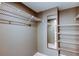 Spacious walk-in closet with wire shelving and a mirror at 6265 Sun Blvd # 806, St Petersburg, FL 33715