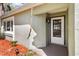 Close-up showcasing the front door of a home with decorative details and a well-lit entrance at 6888 124Th Ave, Largo, FL 33773