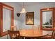 Dining Room features a wood table and floors and a view from the windows at 702 Pass A Grille Way, St Pete Beach, FL 33706