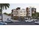Modern building with balconies, rooftop terrace, and parking in a tropical setting at 702 Pass A Grille Way, St Pete Beach, FL 33706