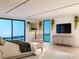 Inviting primary bedroom featuring water views, modern decor, and ample natural light at 702 Pass A Grille Way, St Pete Beach, FL 33706