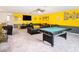 Recreational basement area complete with a pool table, comfortable seating, and lively decor at 7494 Pool Compass Loop, Wesley Chapel, FL 33545