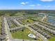 Expansive aerial shot showing the residential community, lakes, and amenities, highlighting the neighborhood's layout at 7580 Freesia Trce, Wesley Chapel, FL 33545