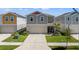 Charming two story home with a manicured lawn and a two car garage at 7580 Freesia Trce, Wesley Chapel, FL 33545