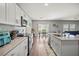 Well-equipped kitchen featuring stainless steel appliances and a breakfast bar with seating at 7580 Freesia Trce, Wesley Chapel, FL 33545