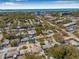 Wide aerial shot of the neighborhood, offering a view of the property and its proximity to the coast at 762 Marjon Ave, Dunedin, FL 34698