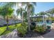 Lush backyard featuring an in-ground pool, mature landscaping, a pergola covered BBQ area, and a serene atmosphere at 7922 Spring Valley Dr, Tampa, FL 33615