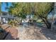 Landscaped backyard with patio and covered outdoor seating area at 7922 Spring Valley Dr, Tampa, FL 33615