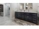 Large bathroom with a double sink vanity and a large glass door shower at 7922 Spring Valley Dr, Tampa, FL 33615