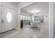 Bright and airy living room featuring neutral decor, a large front windows, and an open layout at 7922 Spring Valley Dr, Tampa, FL 33615